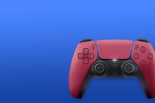 Next Generation red game controller isolated on blue surface. Top view.