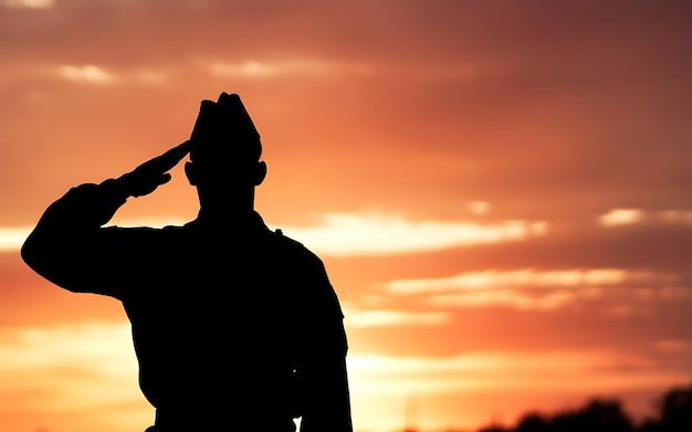 Photo generativeai silhouette of a soldier saluting against a sunset clear area for text