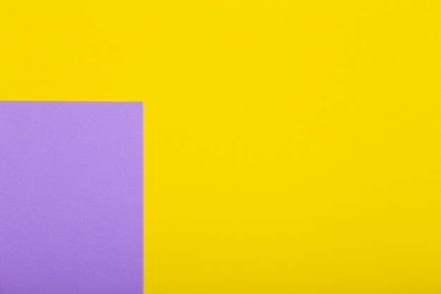 Geometric paper background of yellow and purple colors