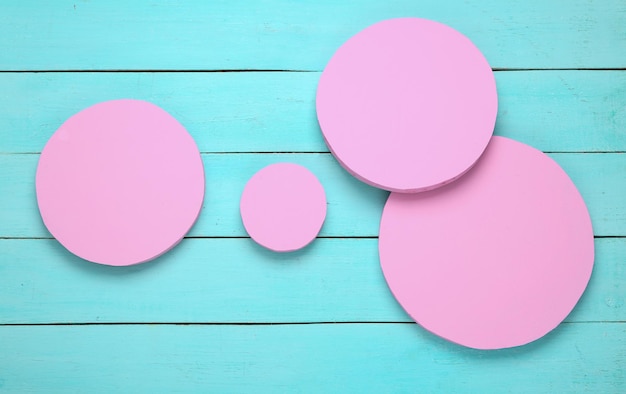 Geometric shapes Circle on a blue wooden background Top view MInimalism Fresh idea