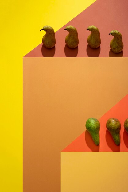 Geometric still life with pears on a colored background