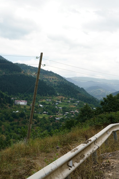 Georgian mountain landscape with a country road a view of the woodlands