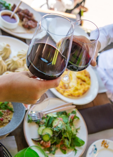 Georgian restaurant food on the table wine in hands