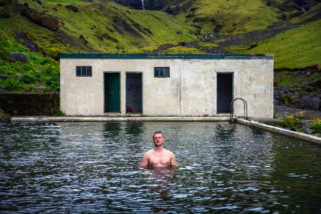 Geothermal swimming pool seljavallalaug in south iceland