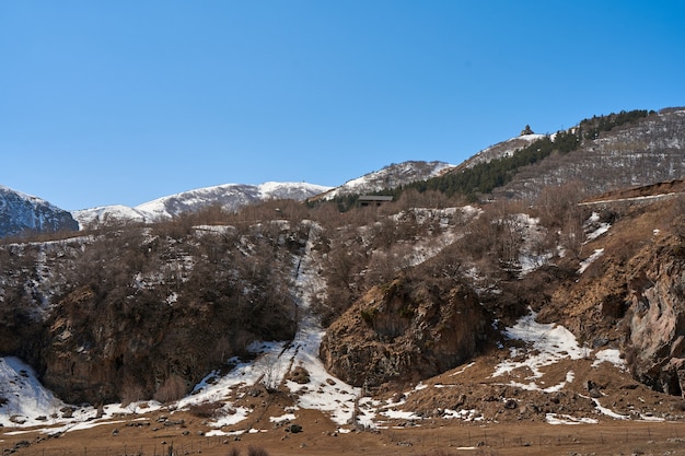 Gergeti Orthodox Church of the Holy Trinity in the mountains of Georgia. An authentic spiritual place