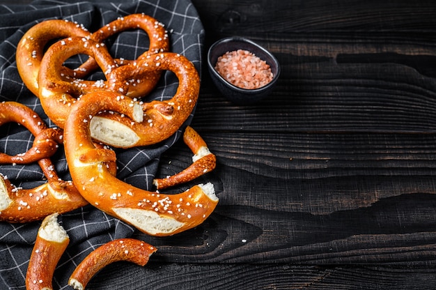 German baked Salted pretzels on a wooden rustic table