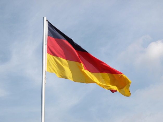 German flag over blue sky