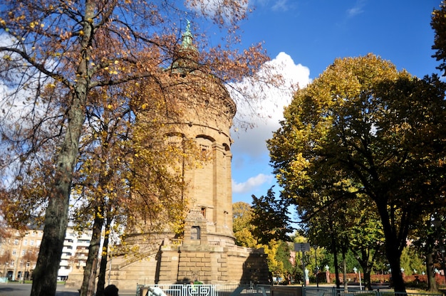 German people and foreign travelers walking travel visit Mannheimer Wasserturm Water tower gardens in Friedrichsplatz square public park at Mannheim city November 8 2016 in Baden Wurttemberg Germany