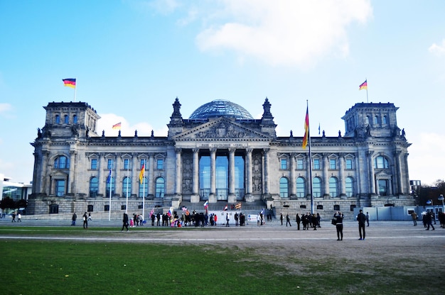 German people and foreigner travelers walk and posing for take photo at front of Reichstag building is historic edifice at Berlin on November 9 2016 in Berlin Germany