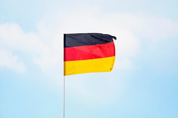 Germany flag on cloudy sky close up waving flag of Germany flag symbols of Germany