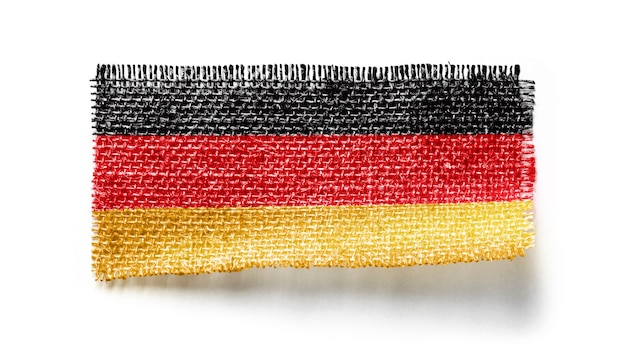 Germany flag on a piece of cloth on white