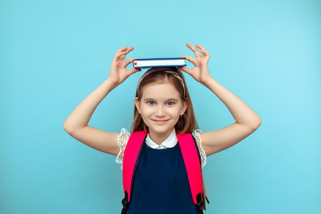 Get ready for class. An inspiring education. Private training. Cute smiling schoolgirl. The girl is a little schoolgirl. School everyday life. School club.