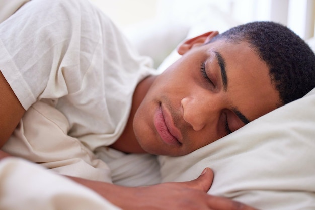 Getting my beauty sleep Cropped shot of a handsome young man sleeping in bed during the early hours of the morning at home