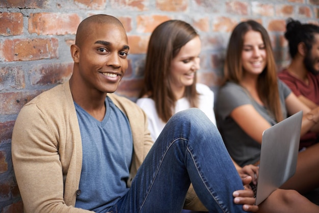 Getting some studying done with friends Shot of a diverse group of friends sitting in a hallway