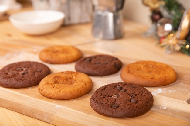 Giant cookies on the wooden plate chocolate and vanilla