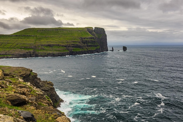 Giant sea cliff and sea stacks on Faroe Islands