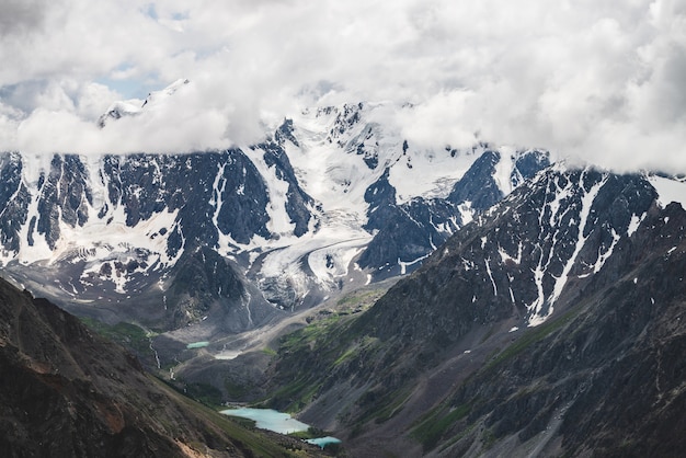 Giant snowy ridge and valley with mountain lakes