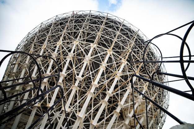 A giant wooden structure with a large metal structure that says'the giant'on it '