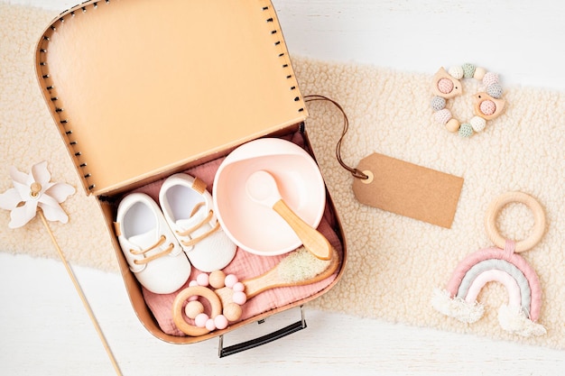 Gift basket with gender neutral baby garment and accessories