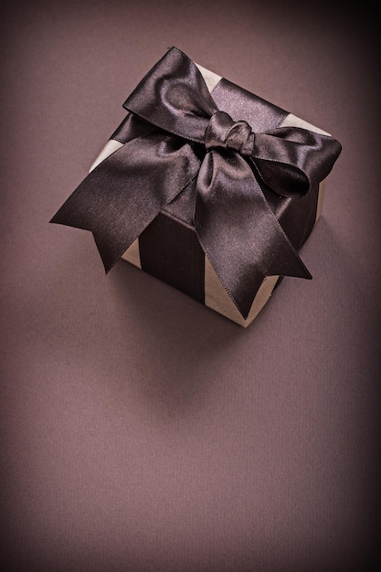 Gift box on brown surface holidays concept