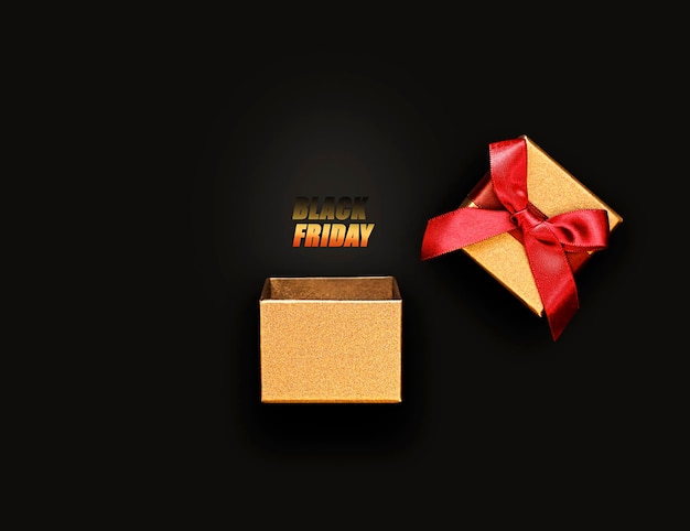 gift box in golden color with an inscription on a black background