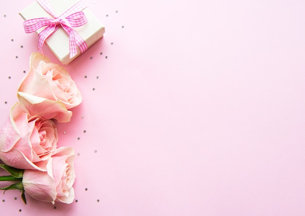 Gift box and pink roses