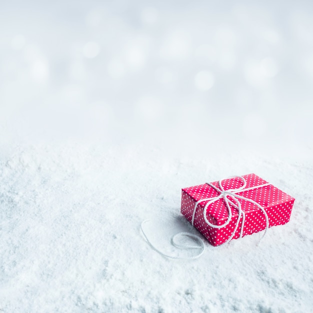 Gift box,present on snow background.For christmas concepts or new year,celebration ideas