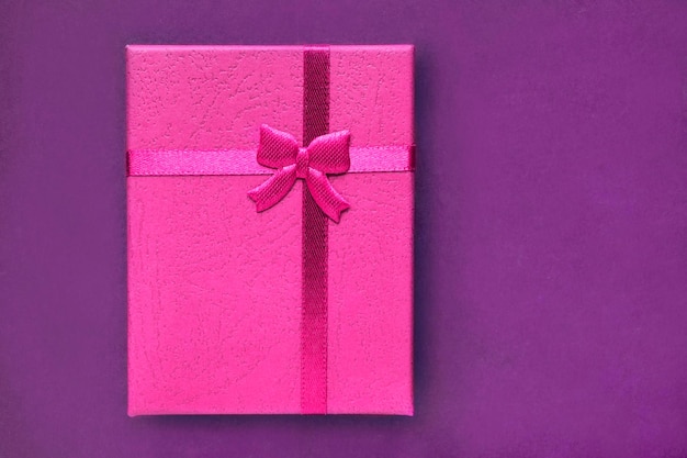 Gift box on purple background