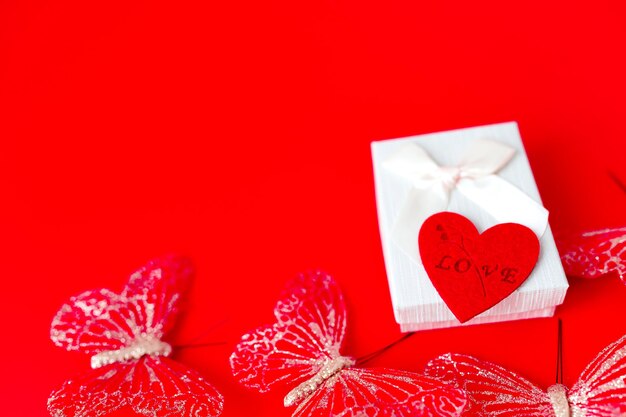 Gift box on red background romantic st valentines day concept of greetings place for your text