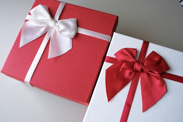 Gift box and red ribbon for romantic couple.