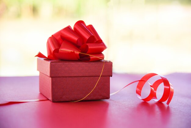 Gift Box red top view nature red present box with red ribbon bow for gift to Merry Christmas Holiday Happy new year or Valentines day