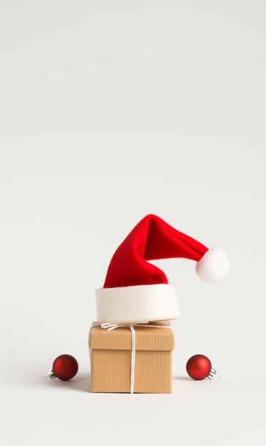 Gift box wear christmas hat isolated on background