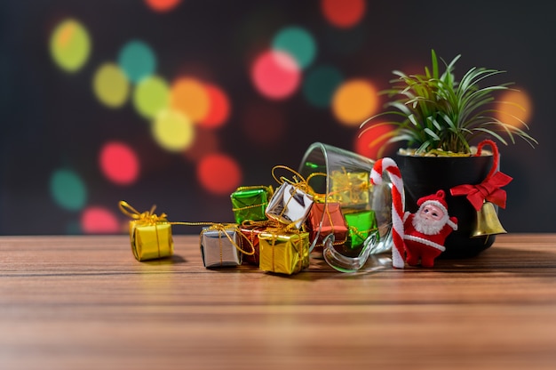 gift box with christmas decoration on wooden table