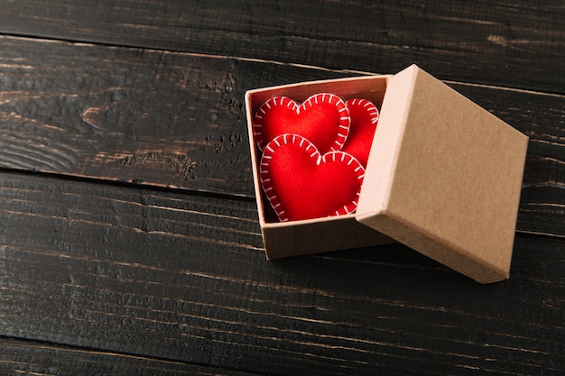 Gift box with red felt hearts for Valentine's day