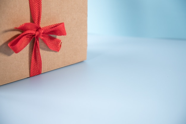 Gift box with red ribbon with copy space