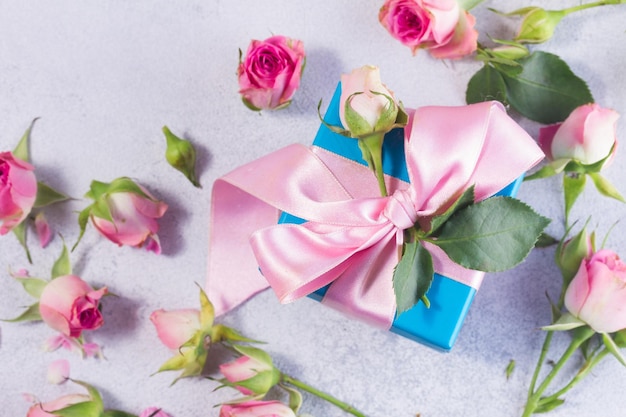 Gift box with satin bow and flowers