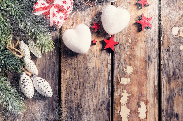 Gift box with stars and heart on dark wooden background