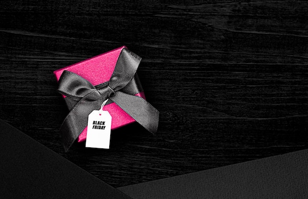 gift box with tag on black background