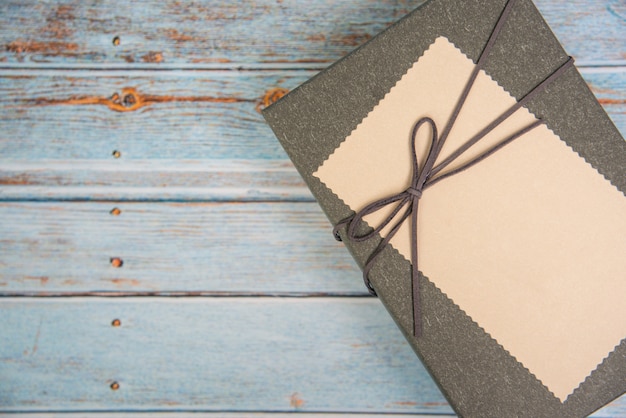 Gift box on wooden table with copy space