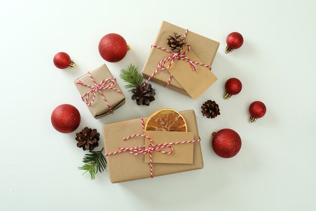 Gift boxes and Christmas accessories on white background