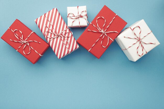 Gift boxes on color background flat lay