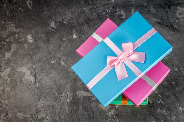 Gift boxes on concrete gray dark background