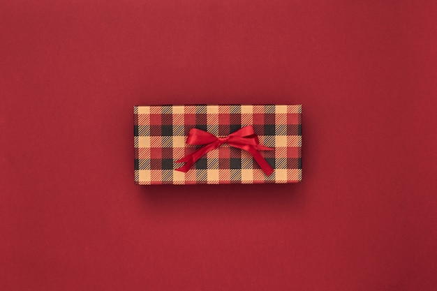 Photo gift boxes and gift bag on a red background. black friday. copy space, flat lay, mock up, top view.