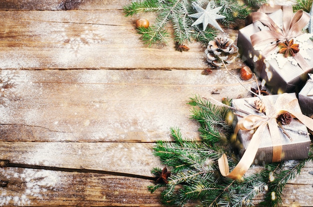 Gift boxes on old wooden background. Christmas card