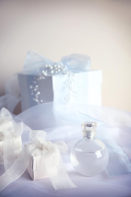 Gift boxes and perfume for wedding day on organza