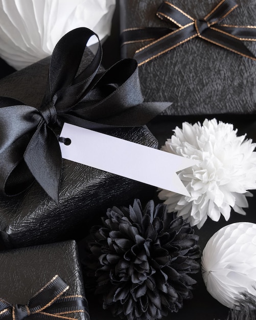 Gift Boxes with Black and white paper flowers and decorations horizontal gift tag Mockup