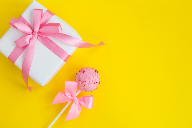 Gift and cake pop with bows