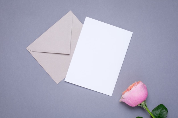 Gift card and envelope with pink rose on gray