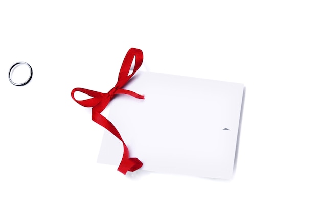 Gift card note with red ribbon on white background