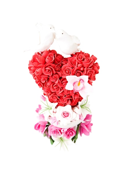 Gift for Valentine's day. Flowers in the shape of heart isolated on white background.